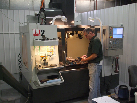 RN Fink employee standing at custom production machine